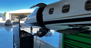 Charter aircraft undergoing scheduled maintenance inspection to maintain Wyvern Wingman PRO charter safety standards