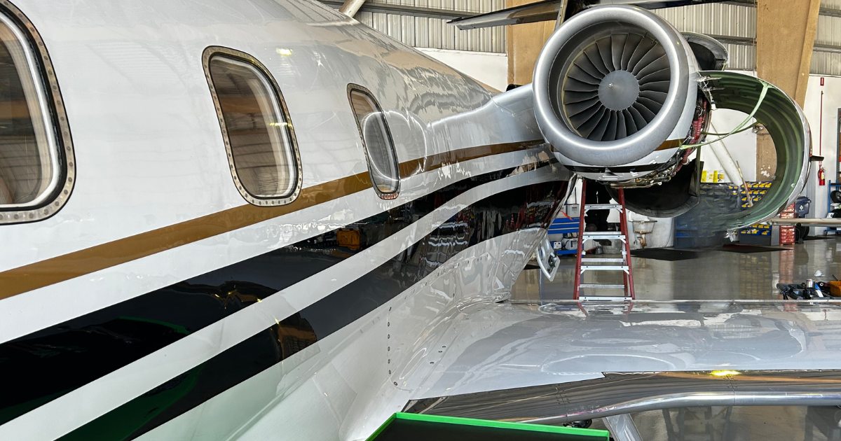 Private jet maintenance inside Hop-A-Jet hangar supporting Wyvern Wingman PRO charter safety renewal in 2026