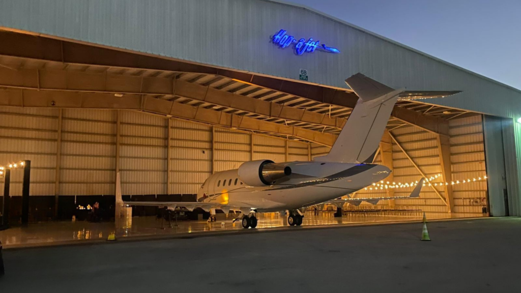 Heavy private jet on runway at sunset, representing how much does it cost to charter a private jet for long-range and large-cabin travel.